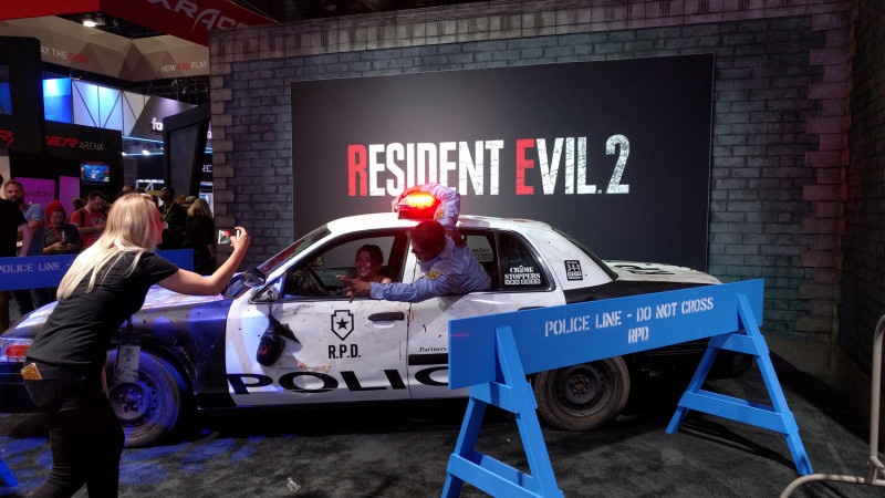 Capcom also has a police car you can sit in and get mauled by a zombie cop while your friend laughs and takes pictures of you. What are you doing, lady? Help her!